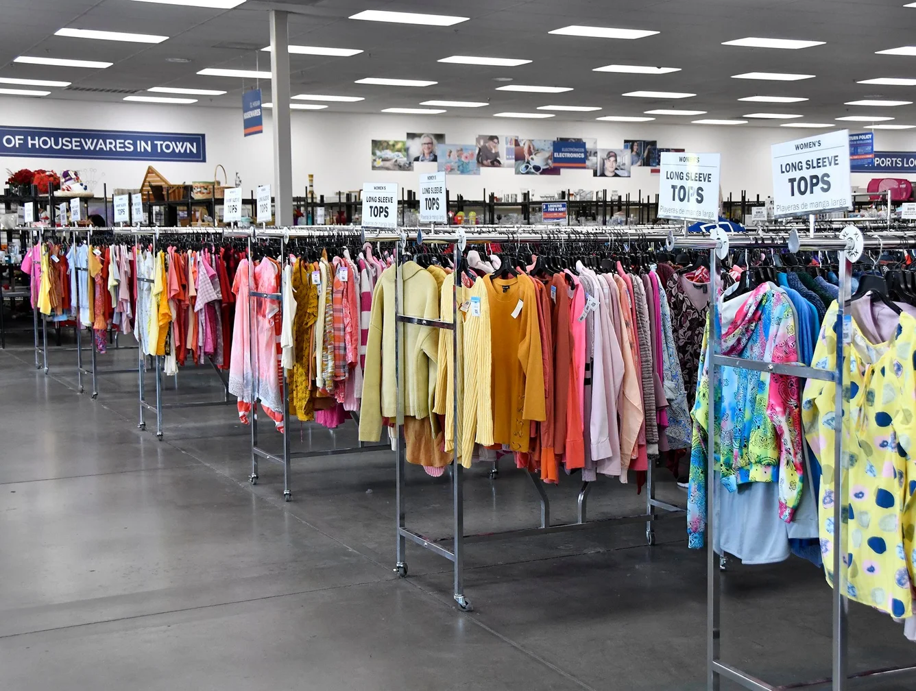 racks of clothes in a goodwill store
