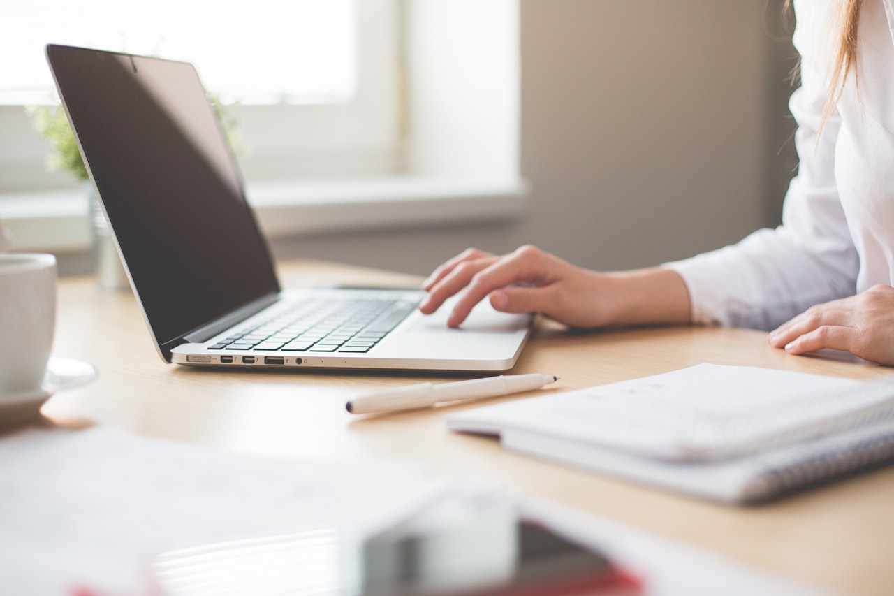 A woman searching on a laptop 